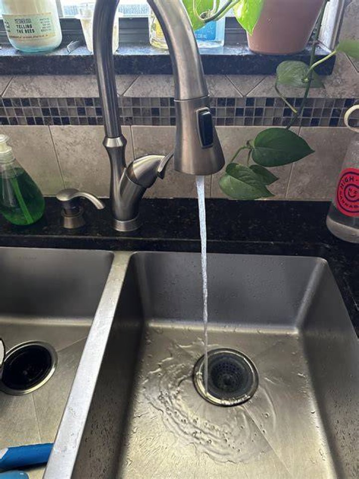 How do I increase the hot water in my kitchen sink